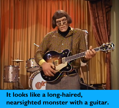longhaired-nearsited-monster-with-a-guitar